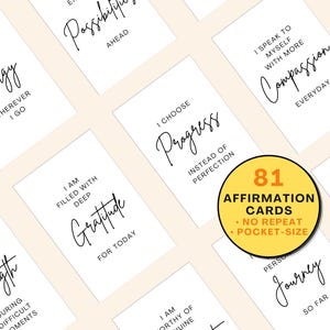 May include: A collection of white affirmation cards with black script, featuring phrases like "Energy" and "Gratitude." A yellow circle displays "81 Affirmation Cards." The cards are pocket-sized and have no repeats.