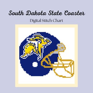 May include: Digital stitch chart featuring a pixelated design of a football helmet with the South Dakota State logo. The helmet is blue and gold, with the text "South Dakota State Coaster" and "Digital Stitch Chart" above the image.