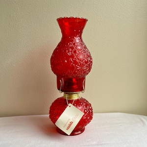 Vintage L.E. Smith Öllampe aus rubinrotem Glas mit Gänseblümchenknopf