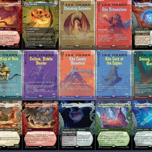 May include: A collection of twenty-one rectangular trading cards featuring J.R.R. Tolkien themed illustrations, including Smaug, The One Ring, and Gandalf. Each card displays colorful artwork, character names, descriptive text, and game statistics.
