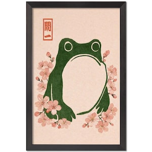 May include: Framed art print featuring a green frog with a large open mouth, surrounded by pink cherry blossoms. The artwork has a minimalist style with a Japanese aesthetic. A red rectangular stamp is in the upper left corner.