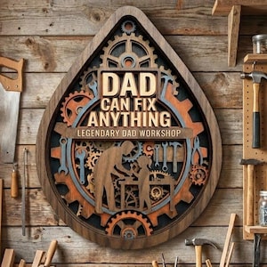 May include: A teardrop-shaped wooden wall sign featuring layered gears and tools. The center text reads DAD CAN FIX ANYTHING and LEGENDARY DAD WORKSHOP. A silhouette of an adult and a child working at a workbench is centered within the gear design.