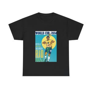 May include: Black t-shirt with a graphic of a footballer in a yellow and green kit, with the text "WORLD CUP 2014" and "RIO BRAZIL". The design includes the cities of Brasilia, Sao Paulo, and Salvador.