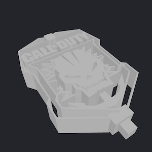 Könnte beinhalten: Hellgraues 3D-gedrucktes Call of Duty-Logo mit Totenkopf-Design. Der Text "CALL DUTY" ist oben sichtbar. Das Design hat eine rechteckige Form mit einem griffartigen Ansatz.