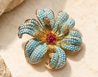 Vergulde botanische bloembroche, bloemspeld met blauwe zirkoonkristallen, elegante bruidscorsage