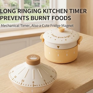 May include: A white ceramic mug with a black handle and the text "But First, Coffee" in a black, handwritten-style font. The mug is on a white surface.