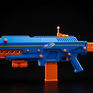 May include: A blue and orange Nerf blaster toy gun. The toy gun has a blue body with orange accents, including the barrel, magazine, and stock. The word "NERF" is printed on the side.