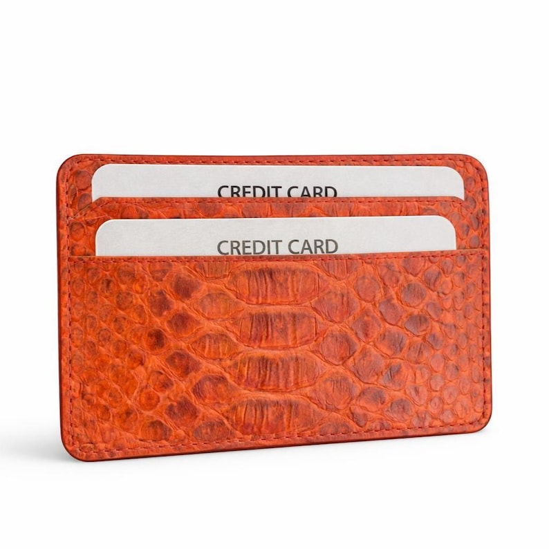 Orange and phyton skin wallet. I can personalize the wallet for you :)
