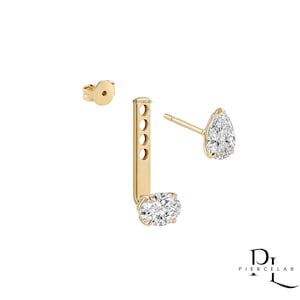 May include: A gold ear jacket earring set featuring a pear-shaped stud with a clear stone and a vertical bar attachment with four adjustment holes and a round clear stone at the base. The text PierceLab is visible on the bar and logo.