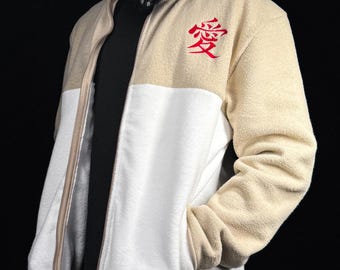 May include: A beige and white color-blocked fleece jacket with a full-length zipper and a stand-up collar. The upper chest area features the red Japanese kanji character for love, which is embroidered on the left side of the garment.