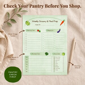 A light green weekly grocery and meal prep notepad with the text "Check Your Pantry Before You Shop." Includes sections for meal prep tasks, shopping list, weekly meals, and pantry check. A pen rests on the right side.