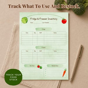 A light green fridge and freezer inventory notepad with the text "Track What To Use And Restock." The notepad has sections for fridge and freezer items, with space for quantity and expiration dates. A pen rests on the surface.