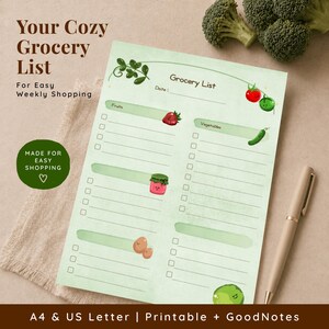 A light green grocery list with the text "Your Cozy Grocery List" and "For Easy Weekly Shopping". The list includes sections for fruits and vegetables, with illustrations of strawberries, a jar of jam, eggs, a cucumber, and tomatoes. A pen rests on the side.