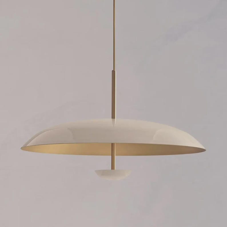 cream pendant light
gold pendant lamp
modern ceiling light
minimalist lighting
Scandinavian lamp
Nordic pendant light
cream ceiling lamp
modern hanging light
gold accent lighting
contemporary pendant
kitchen island light
designer ceiling lamp
minimal home lighting
aesthetic pendant lamp
luxury lighting fixture
disc pendant light
modern interior lighting
elegant ceiling lamp
neutral decor lighting
soft tone pendant
modern home decor light
stylish ceiling fixture
