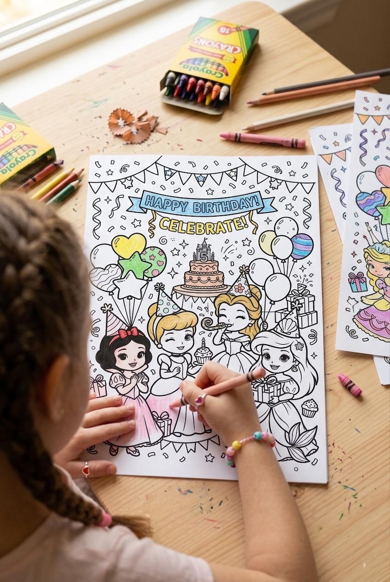 May include: A child coloring a birthday-themed coloring book with princesses, balloons, and a cake. The coloring book has the text "HAPPY BIRTHDAY! CELEBRATE!". Crayons and colored pencils are on the wooden table.