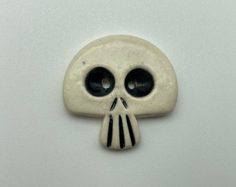 Handmade ceramic skull button