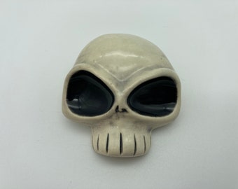 Handmade ceramic skull pin