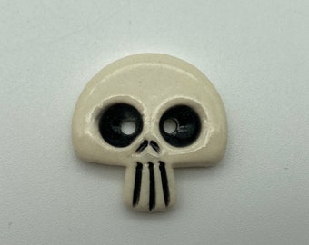 Handmade ceramic skull button