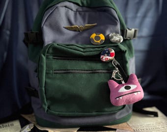 Mochila de lona estilo superviviente postapocalíptico, accesorio de cosplay, mochila vintage con alfileres.