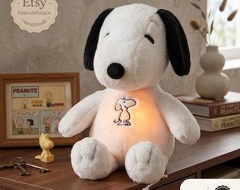 Peluche de Snoopy: respira, suena y emite un suave brillo para momentos acogedores a la hora de dormir.