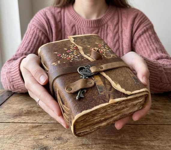 Tree of Life embossed leather journal with genuine antique deckle-edge paper — a classic symbol executed with craft details that lift it above generic.