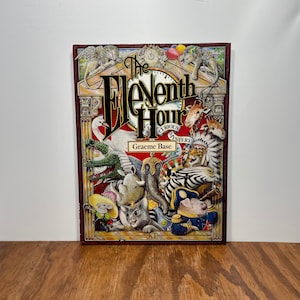 The Eleventh Hour: A Curious Mystery – Illustrated Children’s Book – 1989 Hardcover by Graeme Base - READ CONDITION NOTES