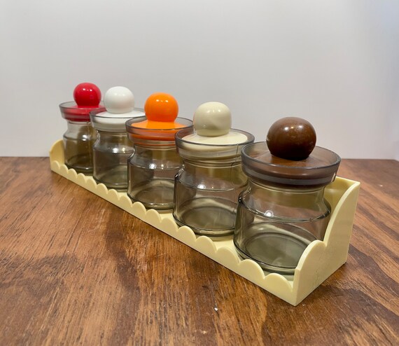 Plastic outlet spice containers