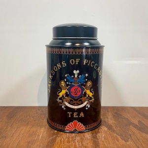 Vintage Jacksons of Piccadilly Tea Tin – Black Metal Canister with Lid – Made in England – Retro Kitchen Decor