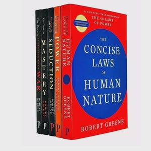 May include: A collection of five books by Robert Greene, including The Concise Laws of Human Nature, The Concise 48 Laws of Power, The Concise Art of Seduction, Mastery, and The Concise 33 Strategies of War, featuring red, orange, and black covers.
