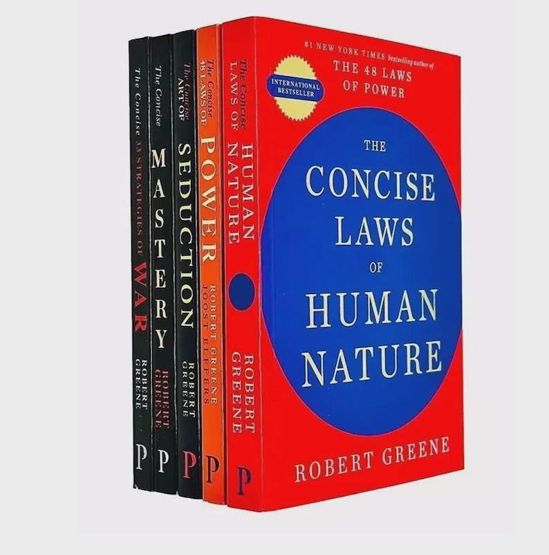 May include: A collection of five books by Robert Greene, including The Concise Laws of Human Nature, The Concise 48 Laws of Power, The Concise Art of Seduction, Mastery, and The Concise 33 Strategies of War, featuring red, orange, and black covers.