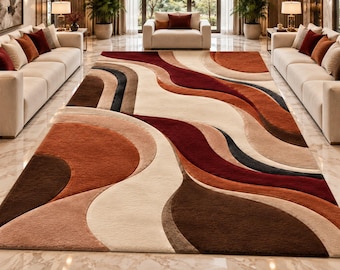 Puede incluir: Una alfombra grande con un patrón abstracto y fluido de formas curvas y onduladas. El diseño incorpora una paleta de colores cálidos que incluye burdeos intenso, naranja quemado, marrón chocolate, beige y crema, creando un efecto visual.