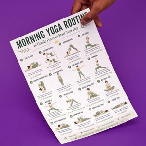 May include: A white poster titled "MORNING YOGA ROUTINE" with 16 gentle yoga poses to start your day. The poster is held by a hand against a purple background. The poses are illustrated with text descriptions and time durations.