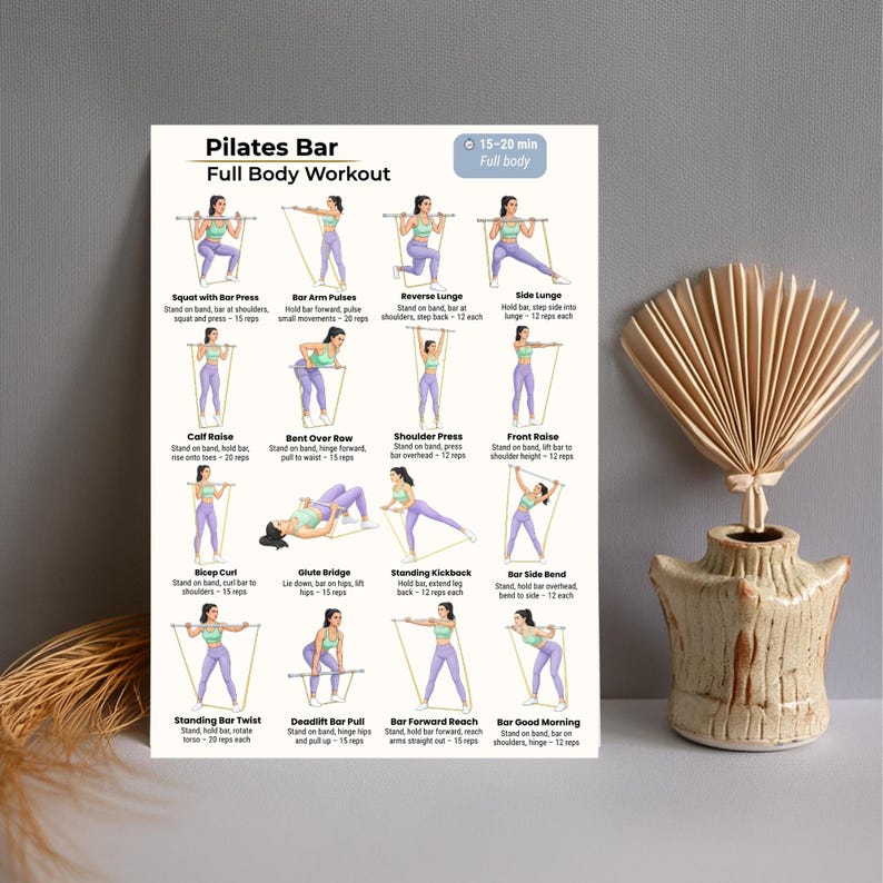 May include: A Pilates Bar Full Body Workout poster with illustrated exercises. The poster features various exercises, including squats, lunges, and presses, with instructions and rep counts. The poster is displayed near a decorative vase with dried flowers.