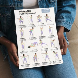 May include: A Pilates Bar Full Body Workout guide with illustrated exercises. The guide includes exercises such as Squat with Bar Press, Reverse Lunge, and Bar Good Morning. The guide is held by a person wearing a denim jacket.