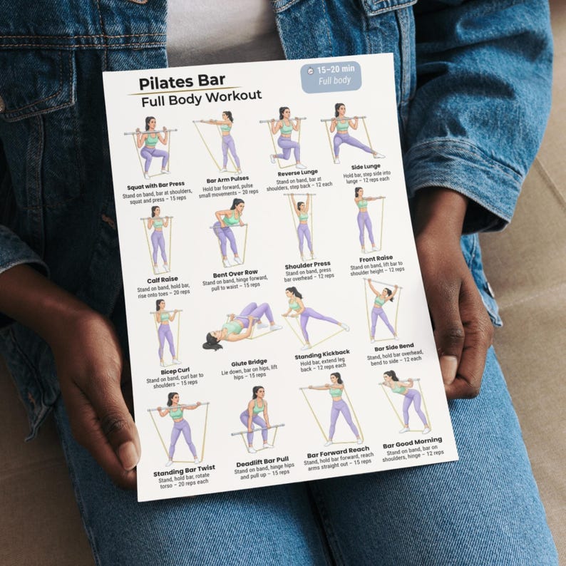 May include: A Pilates Bar Full Body Workout guide with illustrated exercises. The guide includes exercises such as Squat with Bar Press, Reverse Lunge, and Bar Good Morning. The guide is held by a person wearing a denim jacket.