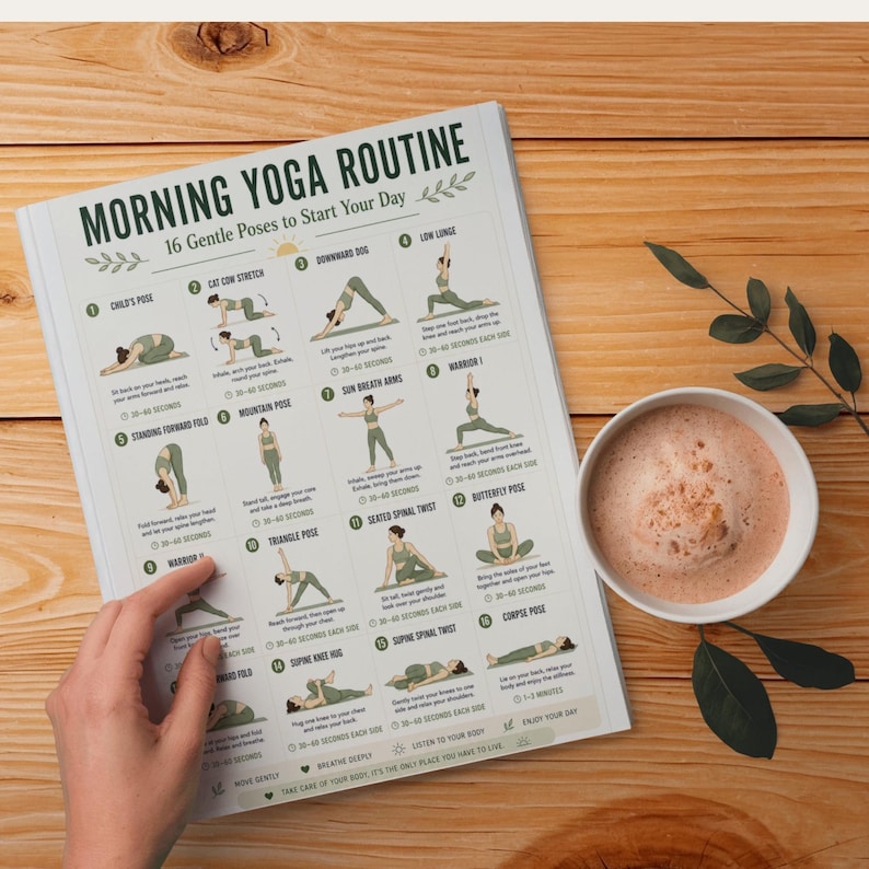 May include: A printed guide titled "MORNING YOGA ROUTINE" with 16 gentle poses to start the day. The guide is on a wooden surface, next to a cup of coffee. The guide includes illustrations and instructions for each yoga pose.