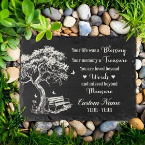 May include: A rectangular black slate memorial plaque featuring a white engraved tree and bench illustration. The text reads: Your life was a Blessing, Your memory a Treasure, You are loved beyond Words and missed beyond Measure, Custom Name, YEAR - YEAR.