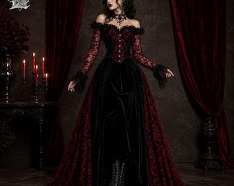 May include: A floor-length gown featuring a black velvet skirt and a dark red lace bodice with long sleeves. The off-the-shoulder neckline is accented with black lace trim, and the bodice includes a central row of buttons. The skirt has a high-low hem.