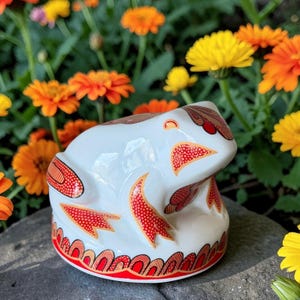 May include: A set of three ceramic mugs with a speckled, matte finish. The mugs are in shades of cream, light gray, and dark gray. Each mug has a simple, minimalist design, perfect for coffee or tea.