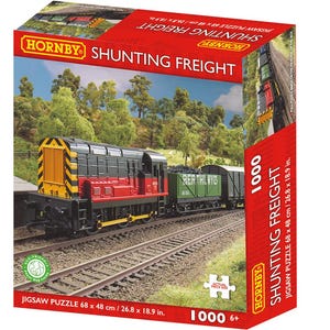 May include: A white ceramic mug with a black handle and the text "But First, Coffee" in a black, handwritten-style font. The mug is on a white surface.