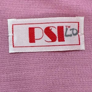 May include: A white label with red text that reads "PSI LO" with a trademark symbol above the "LO".