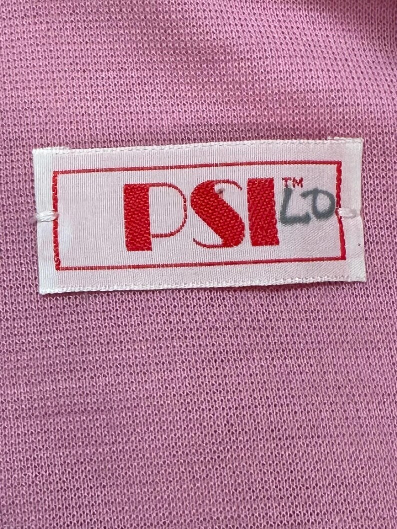 May include: A white label with red text that reads "PSI LO" with a trademark symbol above the "LO".