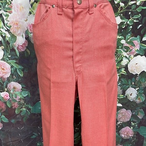 May include: A pair of salmon-colored pants with a straight leg and a high waist.