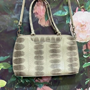 May include: A rustic wooden sign with the text "Welcome to our home" in white lettering. The sign has a distressed finish and a simple, inviting design, ideal for entryway decor.