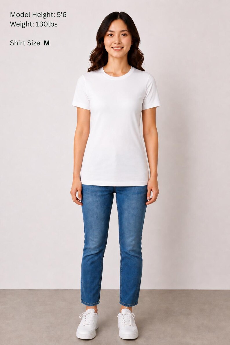 May include: A person wearing a white crew neck t-shirt and blue jeans. The model's height is 5'6" and weighs 130lbs. The shirt size is M.