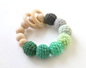 Nursing bracelet, rattle for baby. Teething ring toy with crochet wooden beads in green and grey