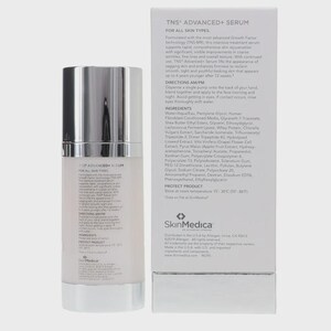 May include: A white cylindrical serum bottle with a silver pump top and a matching rectangular white box. Both items feature black text detailing TNS Advanced+ Serum, including ingredients, directions for AM/PM use, and storage instructions.
