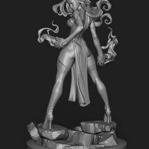 May include: A grayscale 3D-printed figurine of a female character in a dynamic pose. She wears a revealing outfit and high heels, standing on a rocky base. Her long hair flows dramatically, and she holds flowing energy effects.
