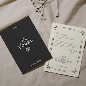 May include: Two wedding vow cards. One is black with white text reading "His Vows" and "Jack and Emily". The other is cream-colored with handwritten vows and the text "Dear Emily" and "With Love, Jacob".