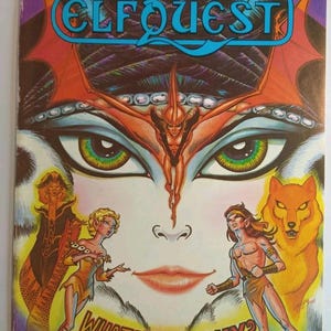 May include: Comic book cover for Elfquest No. 12, with a stylized face and the title in blue and orange. The artwork includes fantasy characters and the text "WHAT IS THE WAY?" in a bold font.